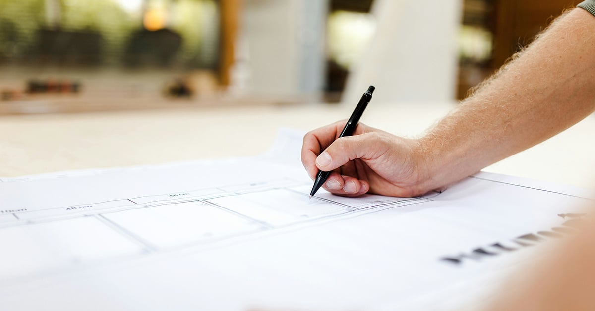 An architect looks over a blueprint that required wide format printing.