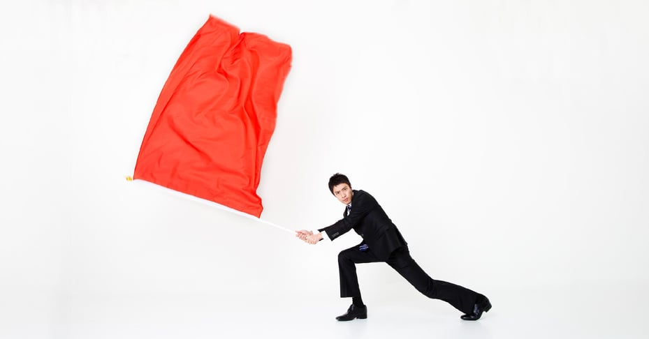 An executive waves a big red flag to alert employees to common business fraud scenarios.