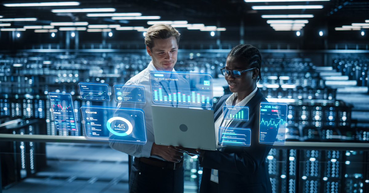 Two IT professionals look at real-time analytics to measure the performance of their modern data center.