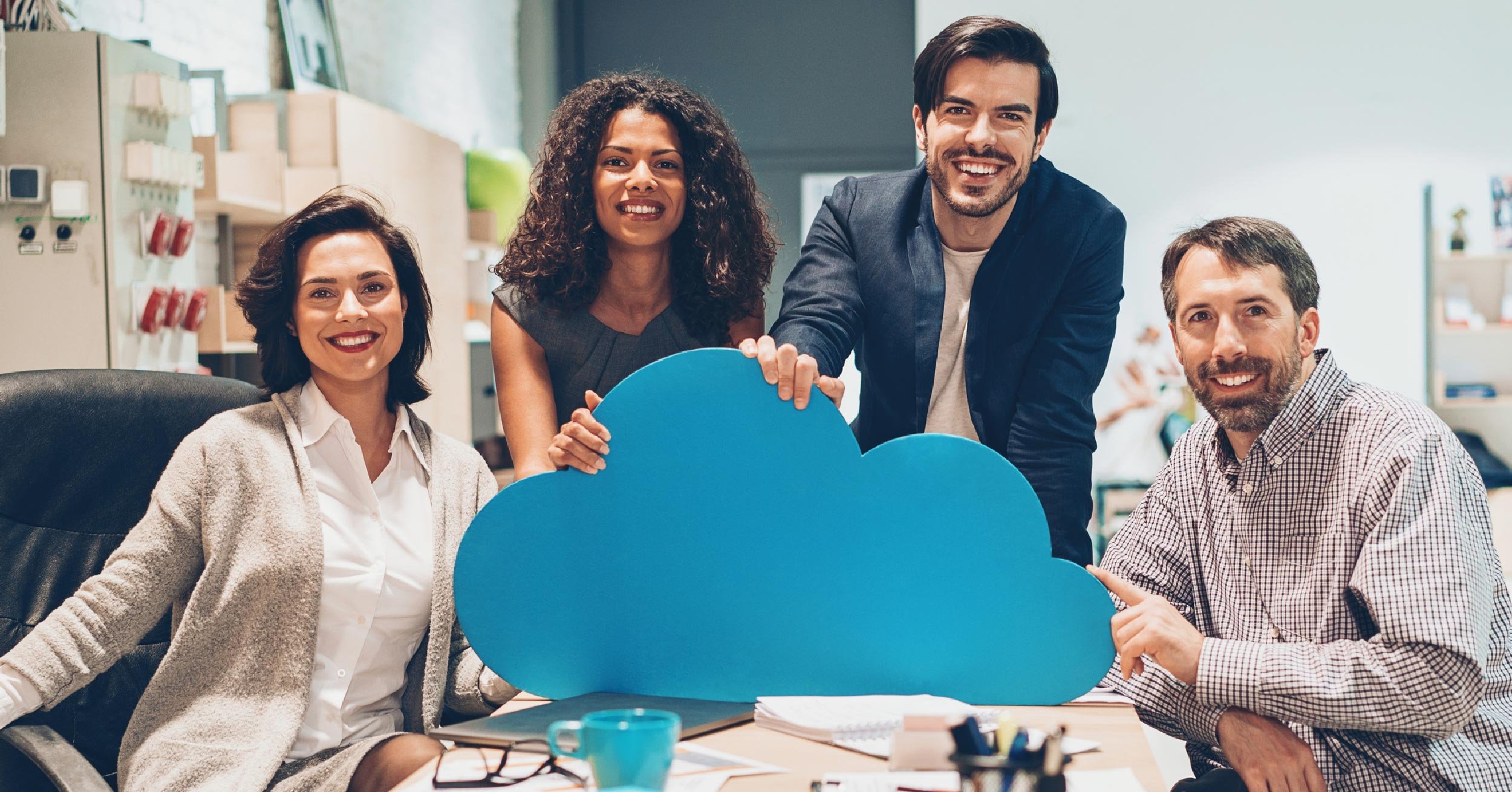 A happy, productive group of employees shows their love for their cloud collaboration tools.